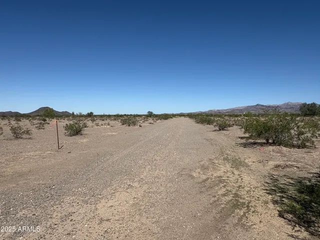 a view of a road with an ocean view