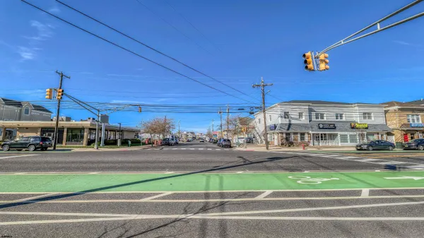 a view of a street with a building in the background