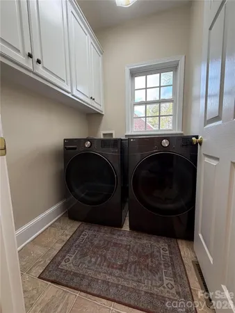 a bathroom with a granite countertop toilet and a shower