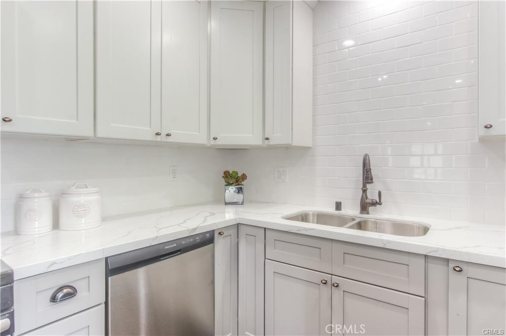 1925 North Screenland Drive Burbank, CA 91505 - Photo 15 of 31 a kitchen with white cabinets and a sink
