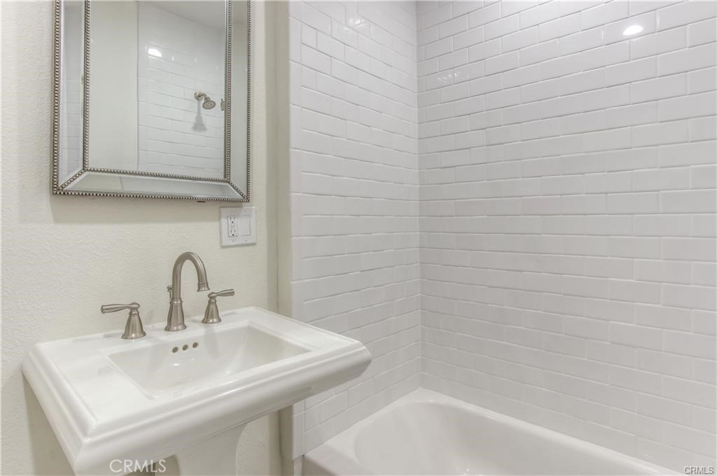 1925 North Screenland Drive Burbank, CA 91505 - Photo 2 of 31 a bathroom with a sink a shower and a mirror