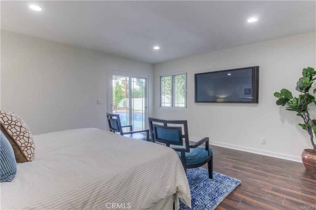 1925 North Screenland Drive Burbank, CA 91505 - Photo 23 of 31 a bedroom with a bed and wooden floor