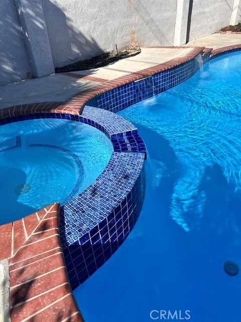 1925 North Screenland Drive Burbank, CA 91505 - Photo 29 of 31 a bed sitting in a room next to a blue wall