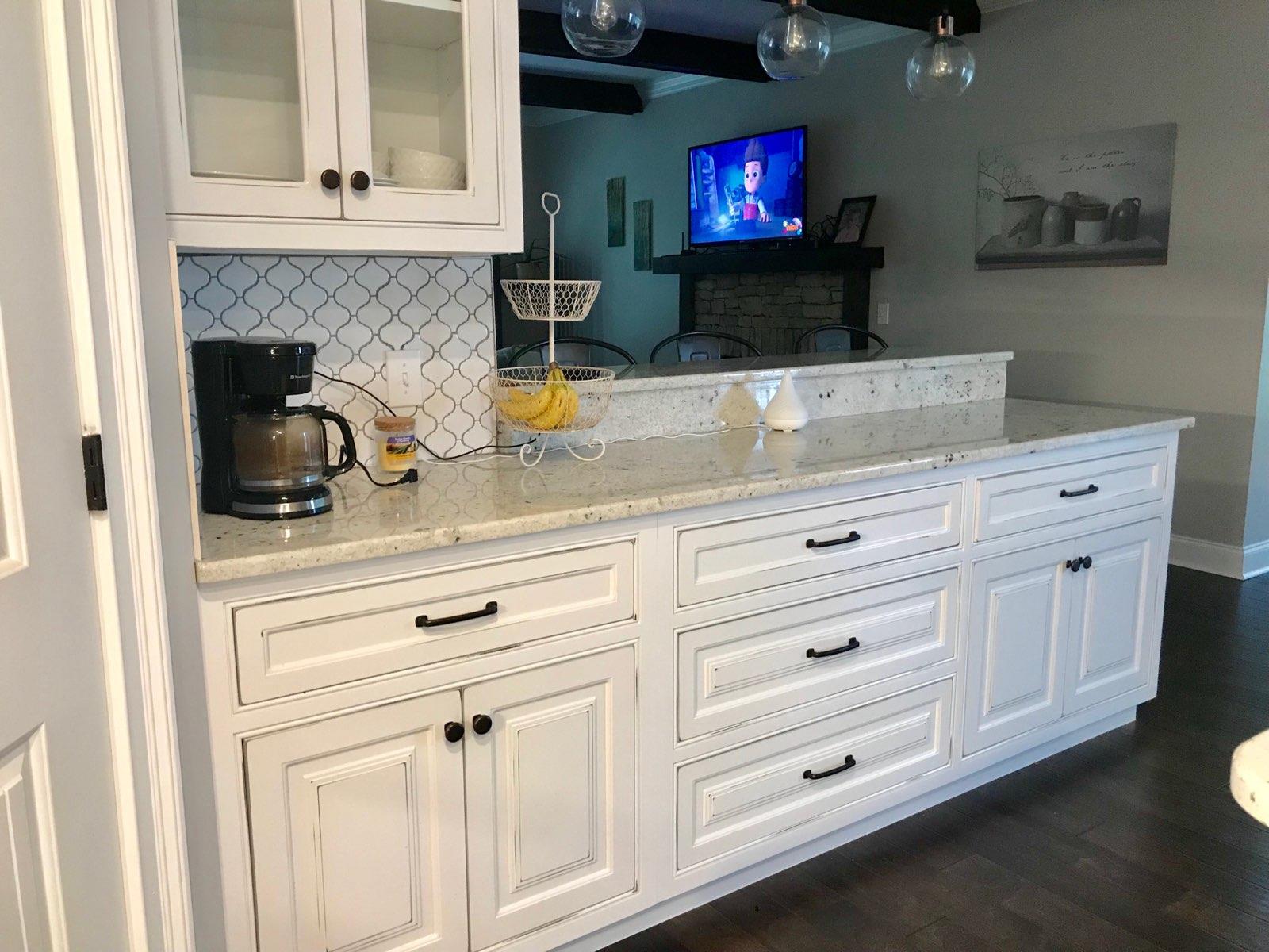84 Old Quick Road Fayetteville, TN 37334 - Photo 4 of 6 a kitchen with white cabinets and a fireplace