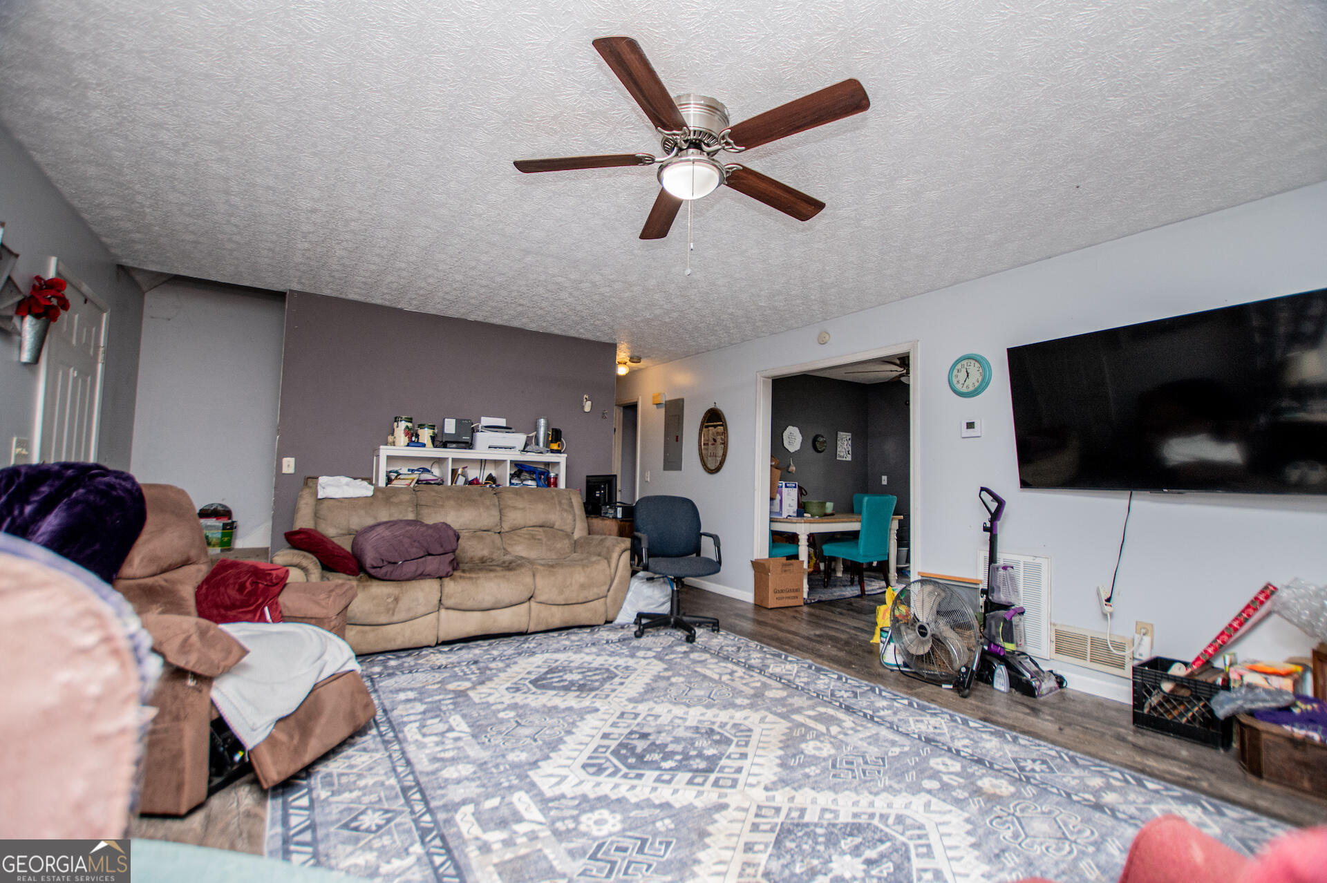 1227 Horsley Mill Road Carrollton, GA 30116 - Photo 13 of 70 a living room with furniture and a flat screen tv