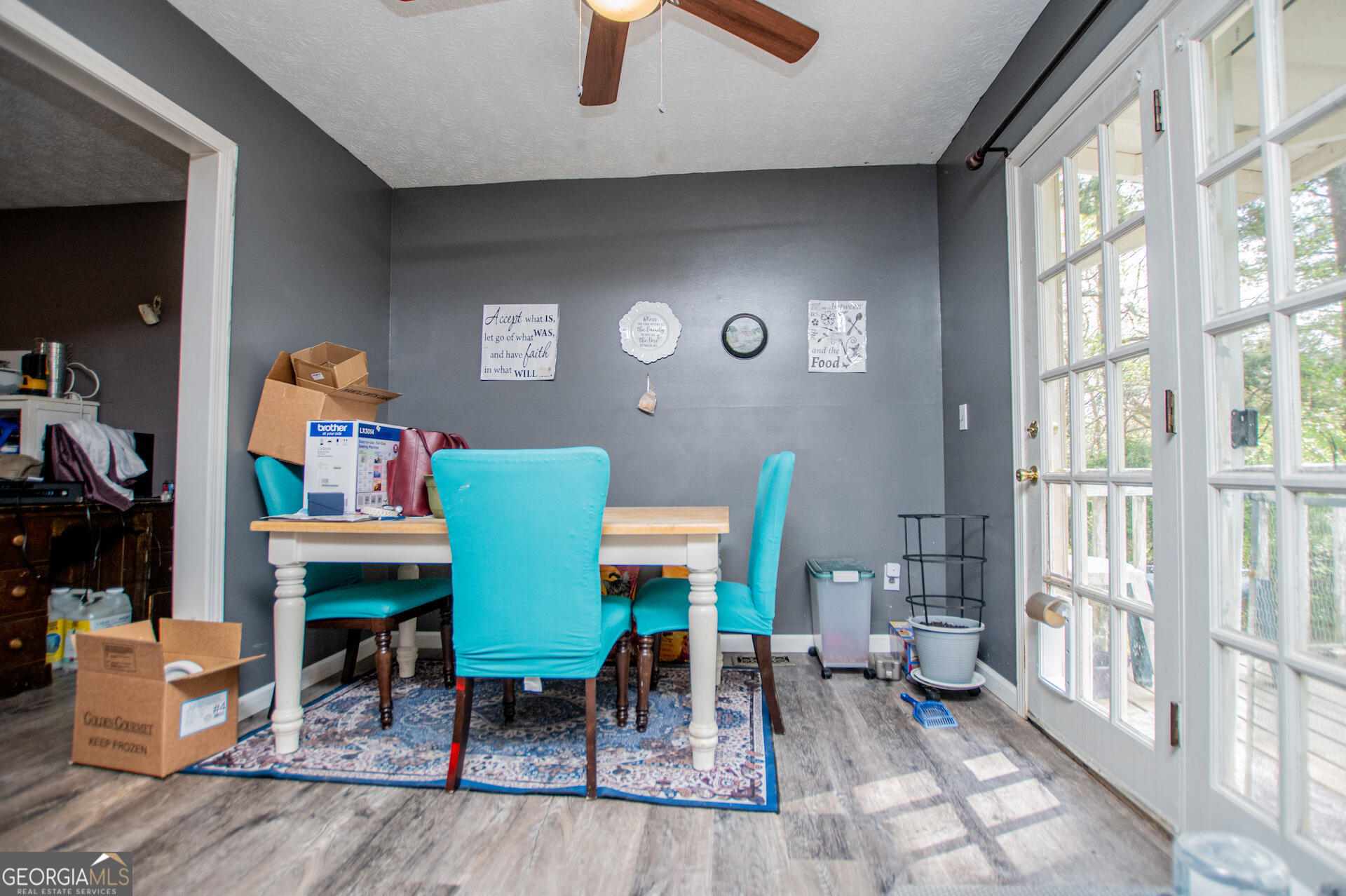 1227 Horsley Mill Road Carrollton, GA 30116 - Photo 17 of 70 a living room with furniture and a floor to ceiling window