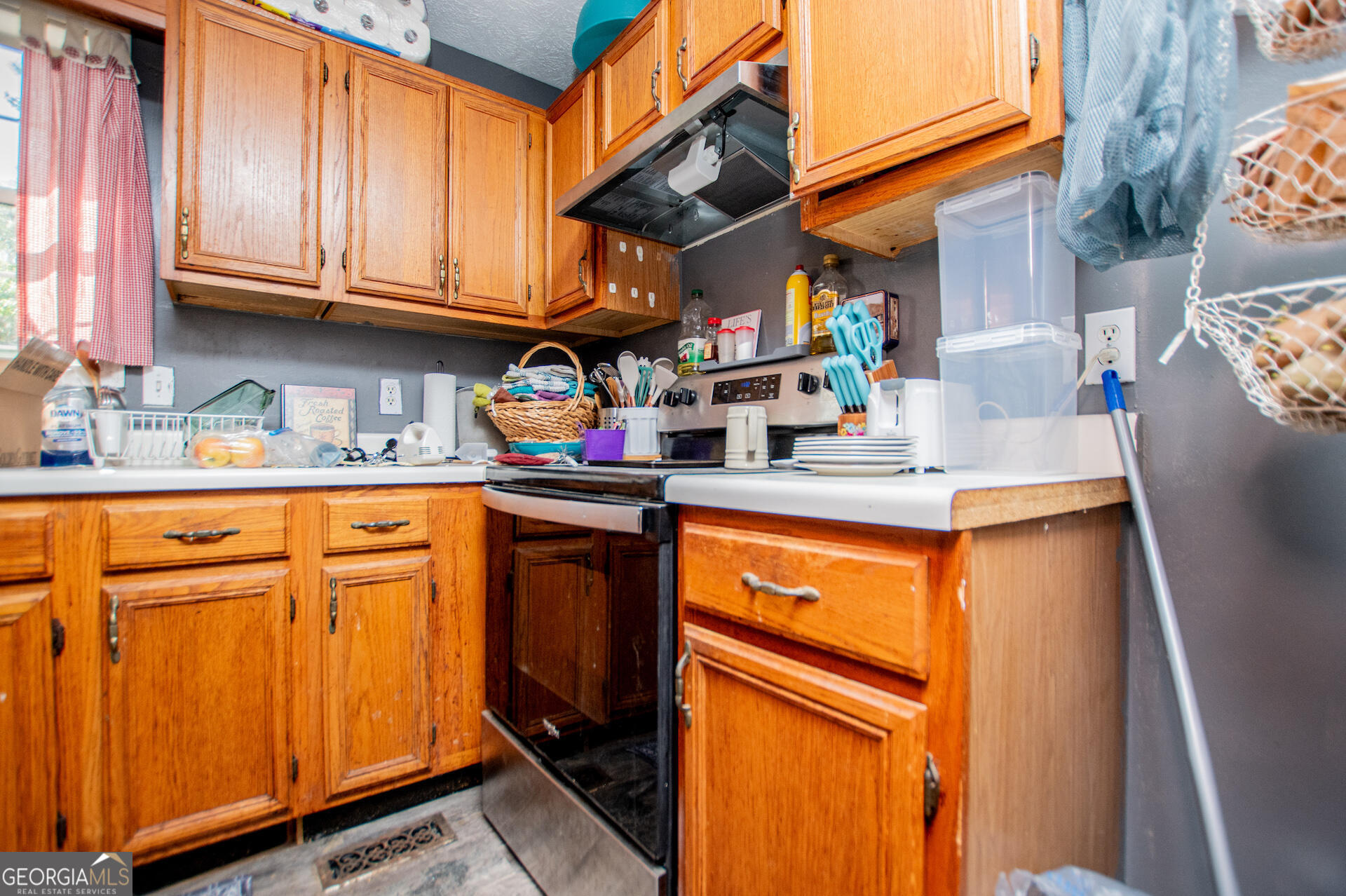 1227 Horsley Mill Road Carrollton, GA 30116 - Photo 20 of 70 a kitchen with stainless steel appliances granite countertop a refrigerator sink and cabinets