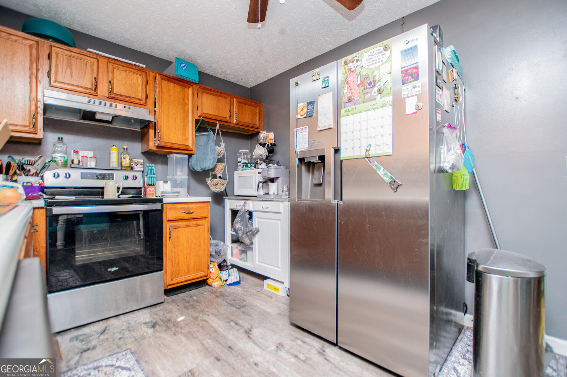 1227 Horsley Mill Road Carrollton, GA 30116 - Photo 22 of 70 a kitchen with stainless steel appliances granite countertop a refrigerator a stove a sink and a window