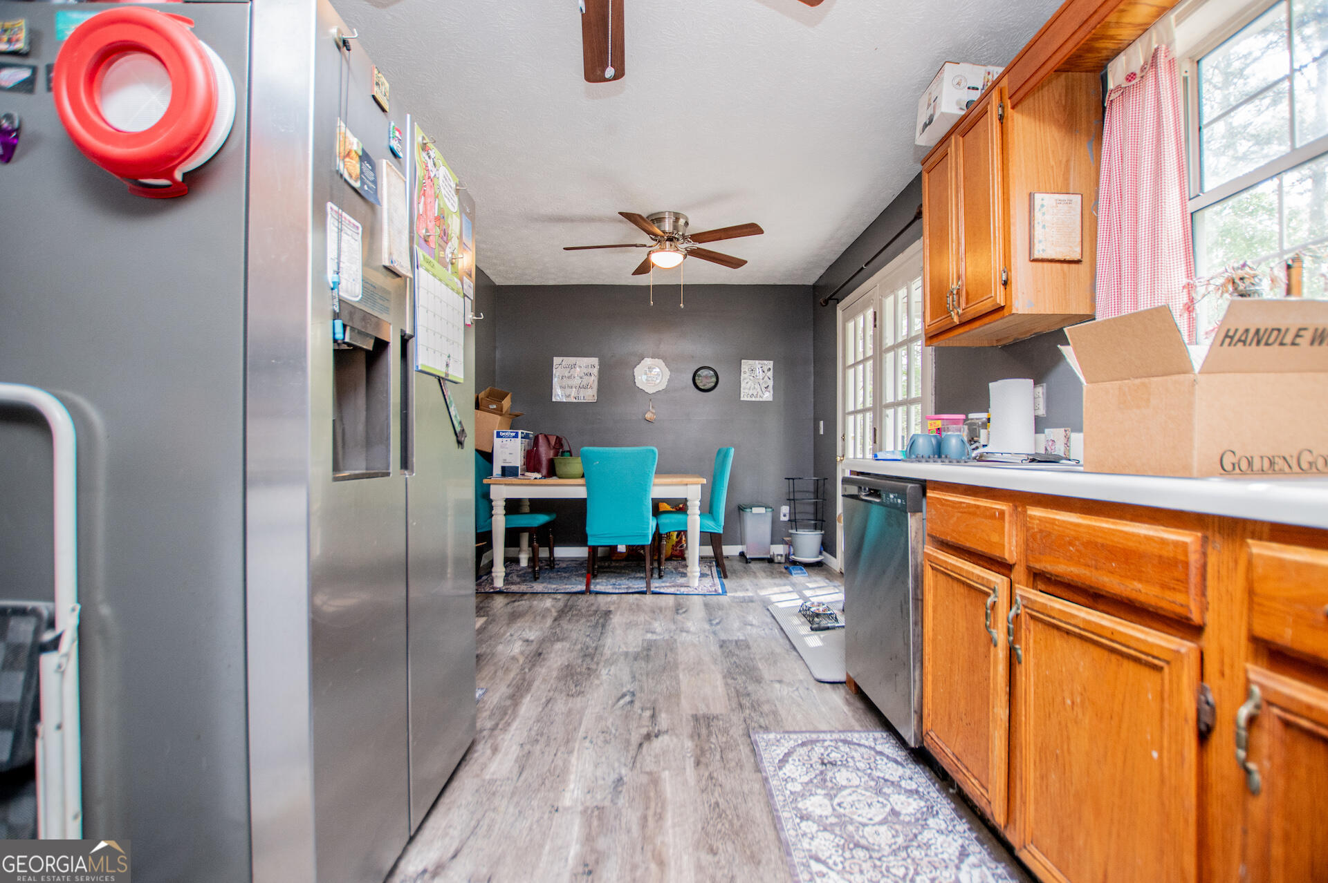 1227 Horsley Mill Road Carrollton, GA 30116 - Photo 25 of 70 a dining room with stainless steel appliances granite countertop a refrigerator and a stove top oven