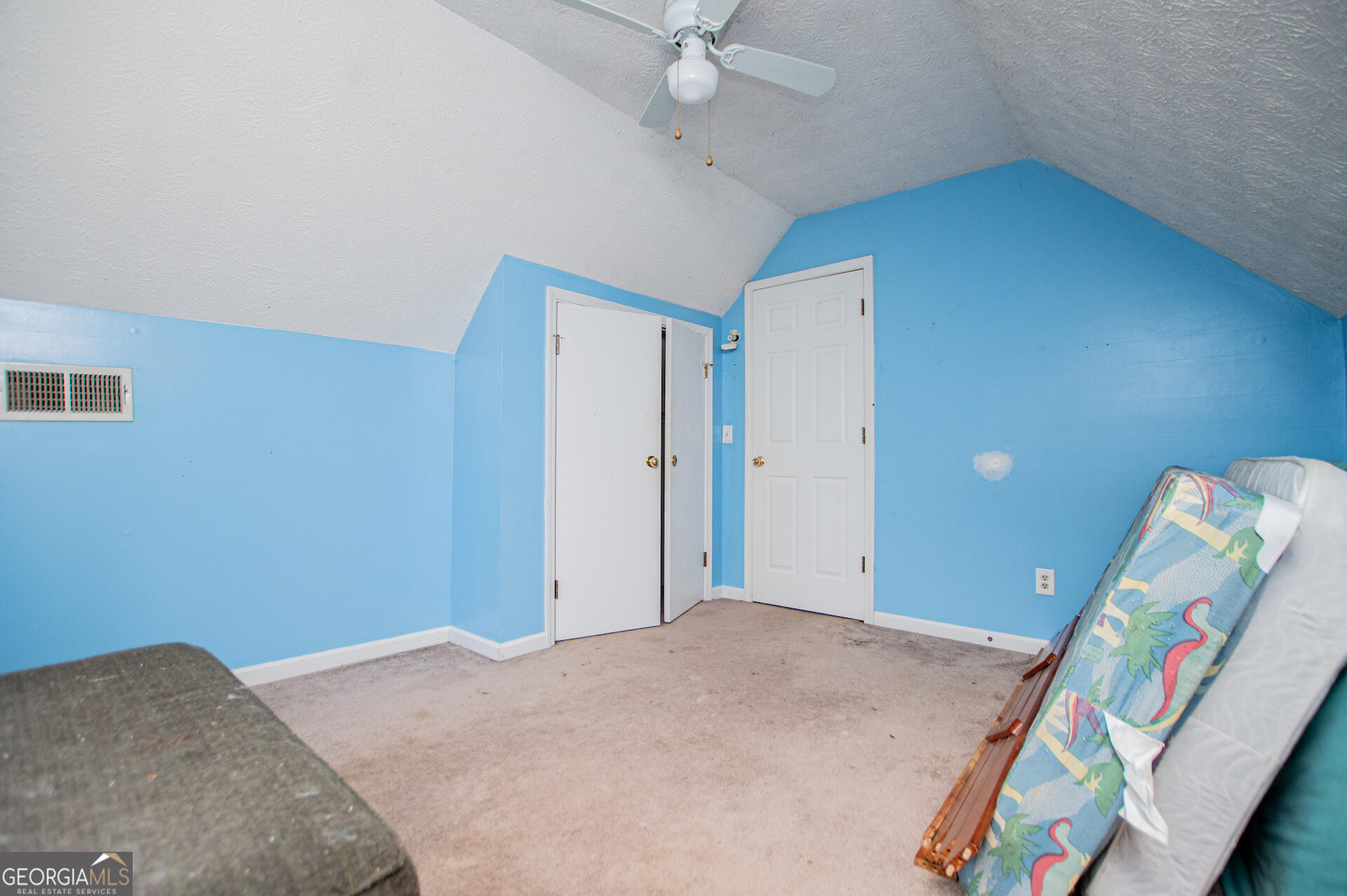 1227 Horsley Mill Road Carrollton, GA 30116 - Photo 34 of 70 a bedroom with a bed and a chandelier