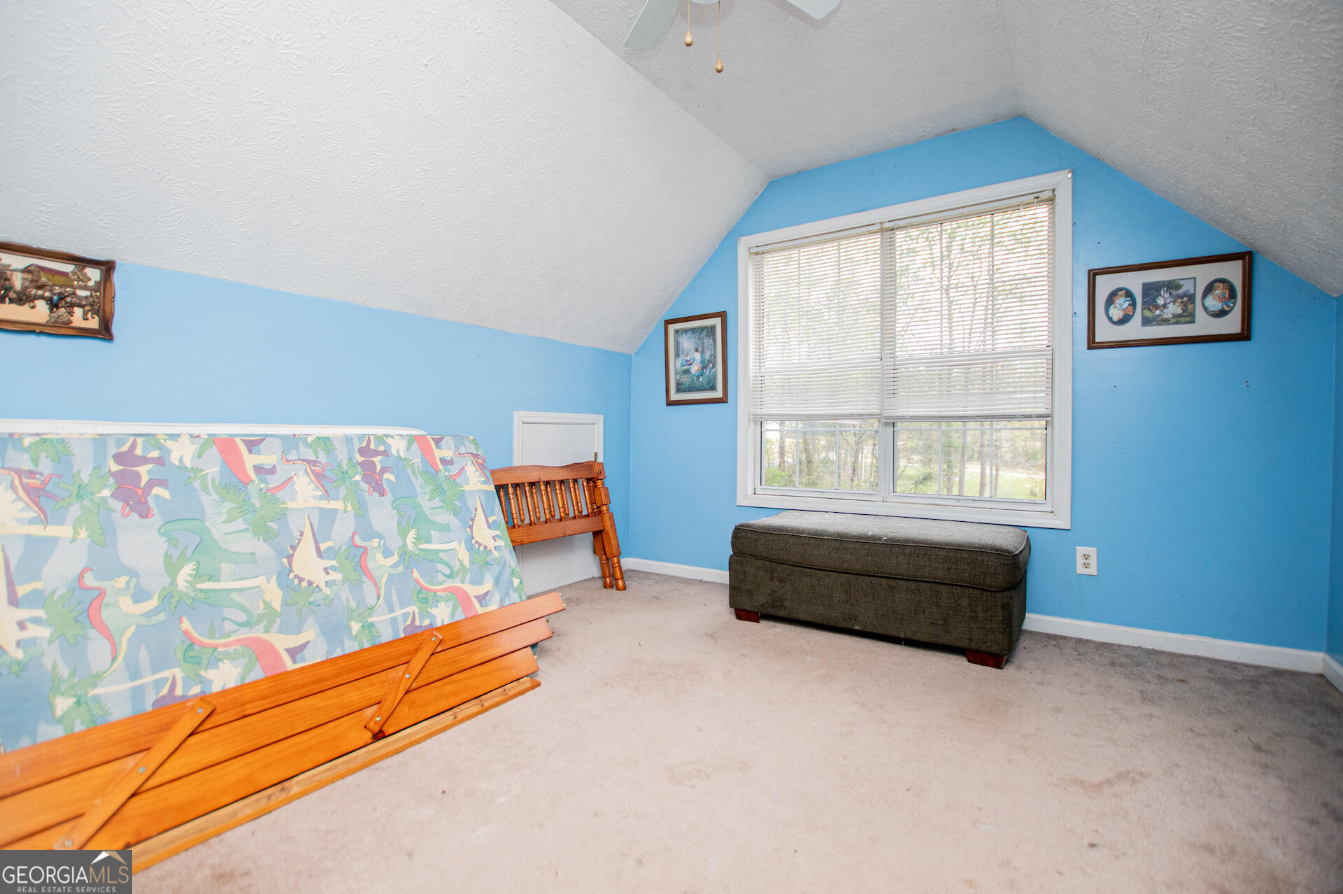 1227 Horsley Mill Road Carrollton, GA 30116 - Photo 35 of 70 a bedroom with a bed and a couch