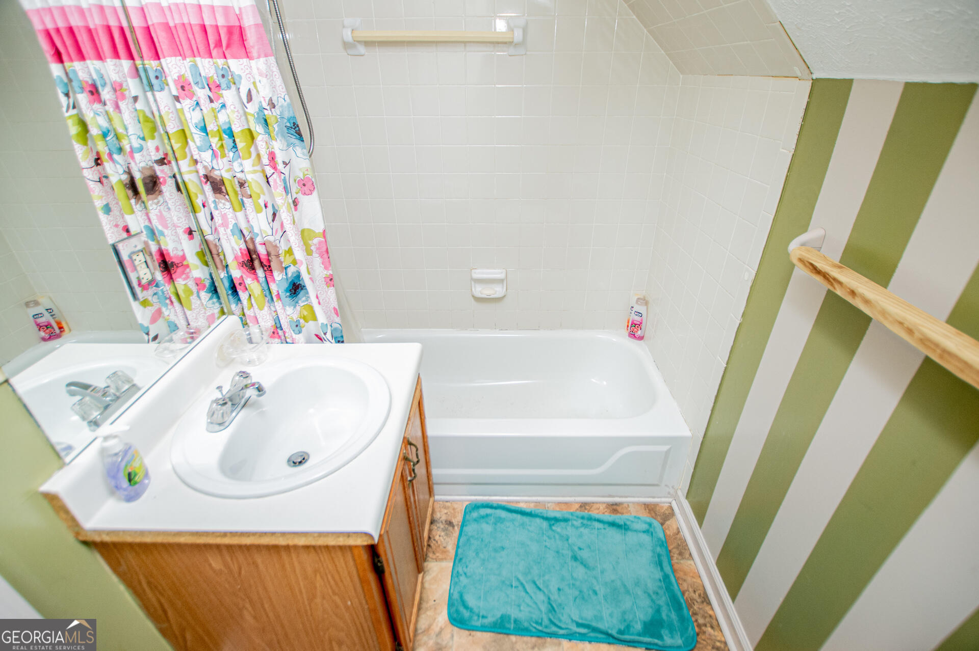 1227 Horsley Mill Road Carrollton, GA 30116 - Photo 37 of 70 a bathroom with a sink and a bathtub