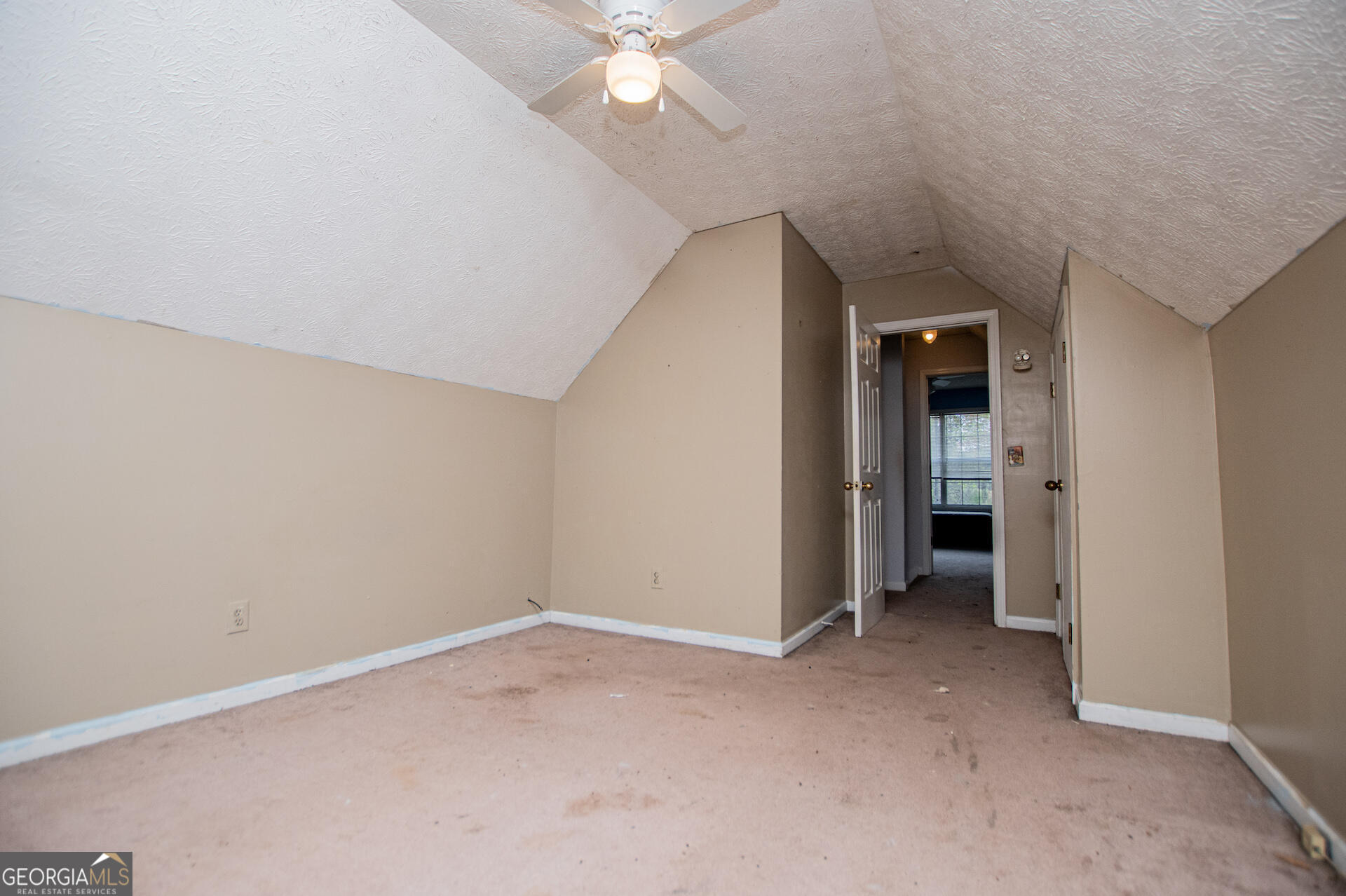 1227 Horsley Mill Road Carrollton, GA 30116 - Photo 40 of 70 an empty room with closet and a ceiling fan