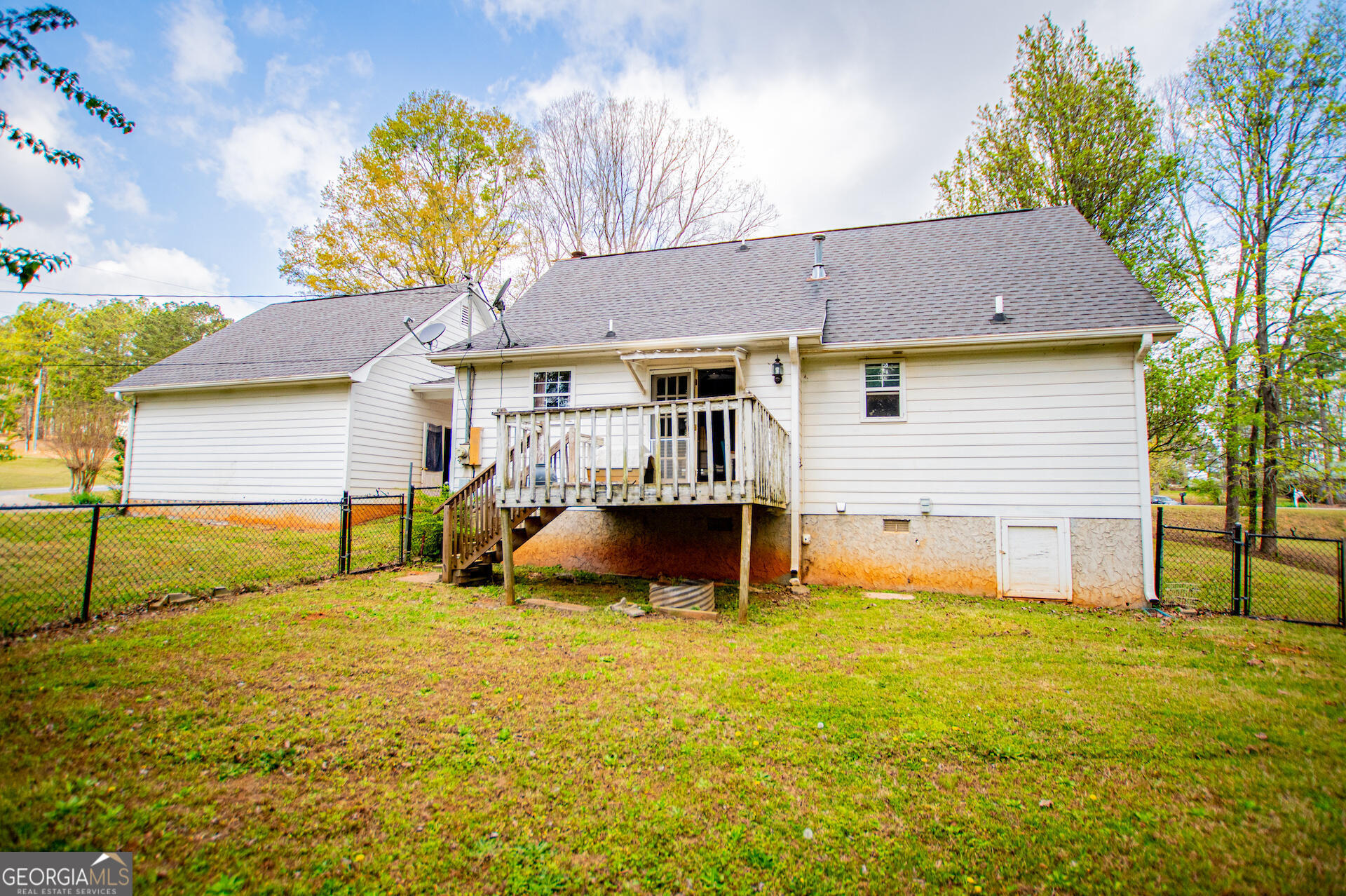 1227 Horsley Mill Road Carrollton, GA 30116 - Photo 51 of 70 a view of a house with a yard and a large tree