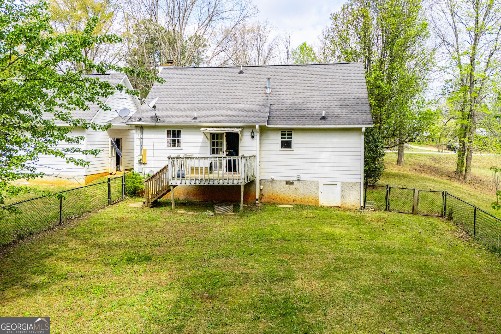 1227 Horsley Mill Road Carrollton, GA 30116 - Photo 67 of 70 a view of house with backyard and a tree