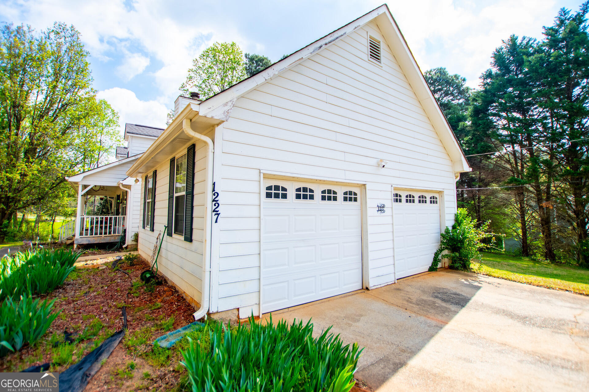 1227 Horsley Mill Road Carrollton, GA 30116 - Photo 7 of 70 a view of a house with a yard