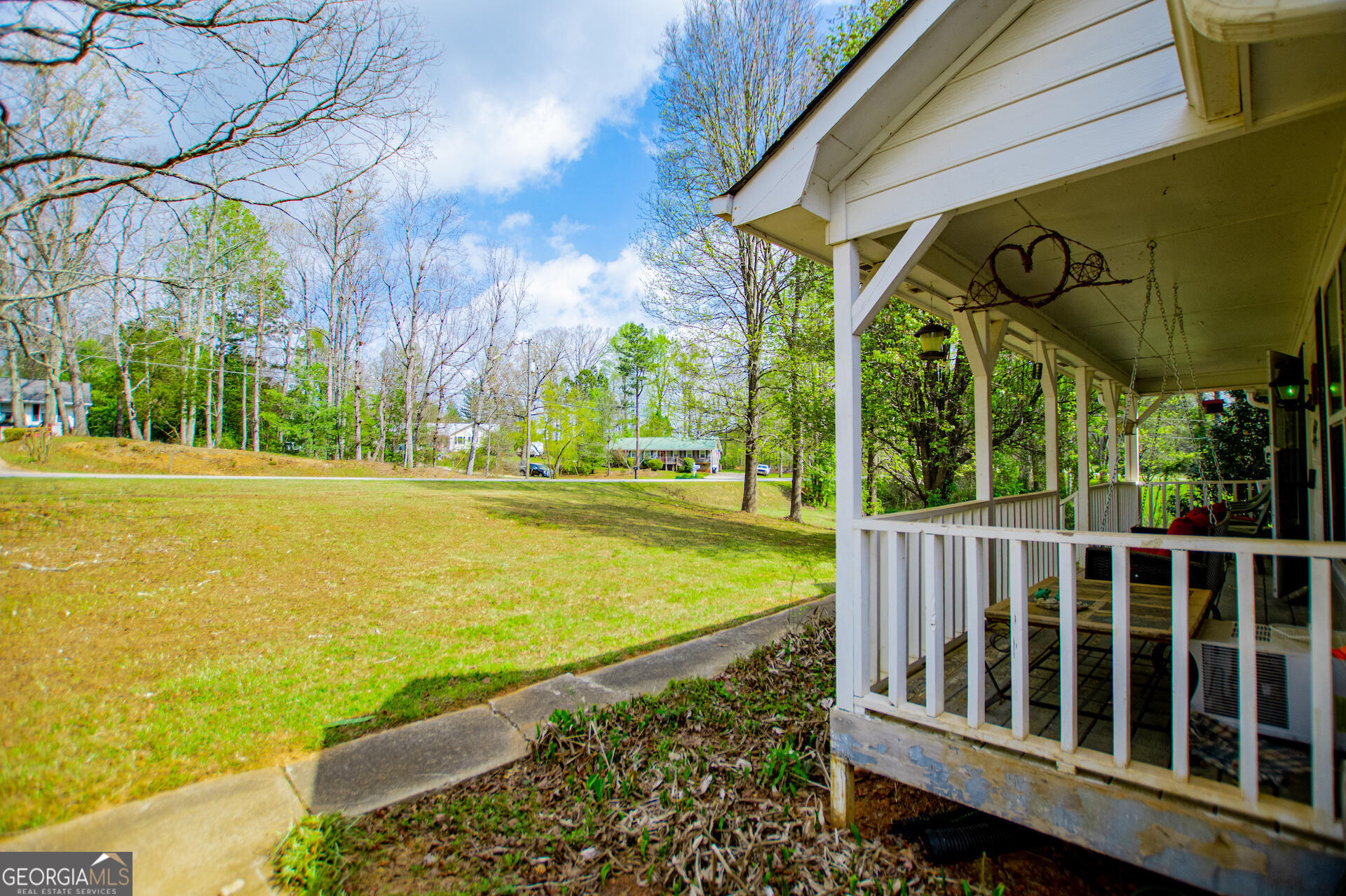 1227 Horsley Mill Road Carrollton, GA 30116 - Photo 8 of 70 a view of a swimming pool with a garden