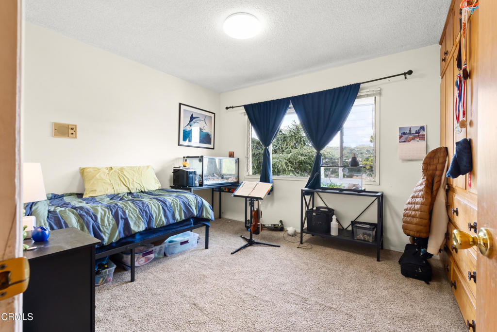 10840 Santa Rosa Road Camarillo, CA 93012 - Photo 35 of 55 a bedroom with a bed and a couch