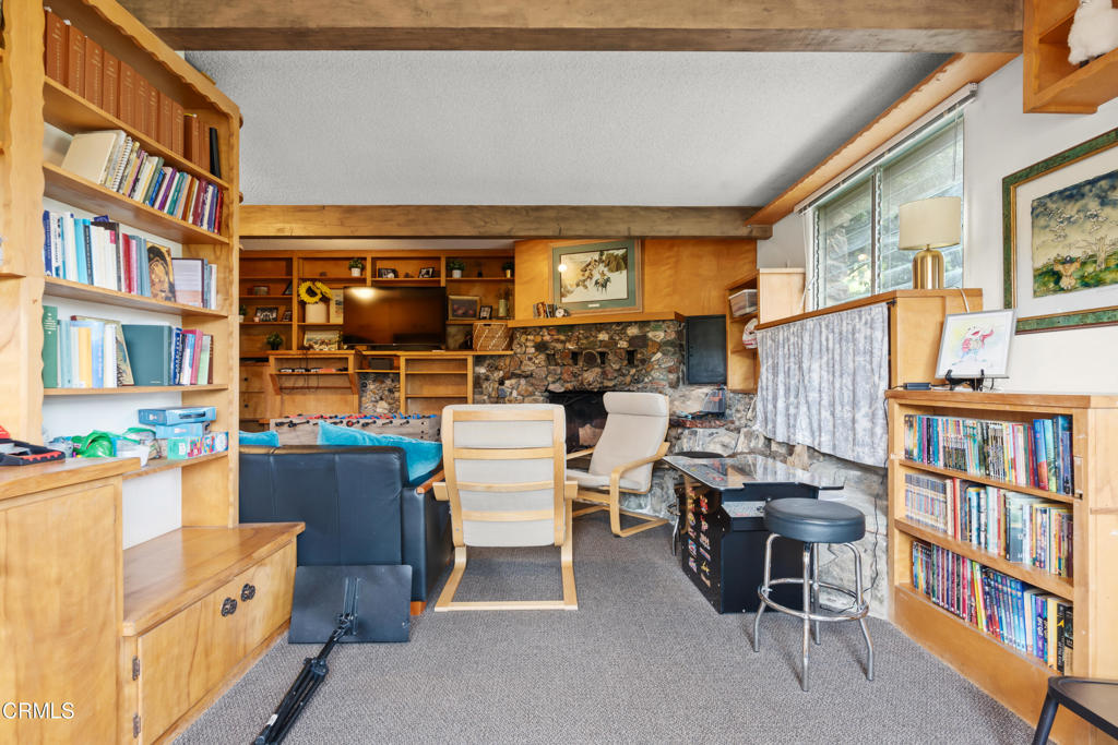 10840 Santa Rosa Road Camarillo, CA 93012 - Photo 36 of 55 a room with furniture a bookshelf and a window