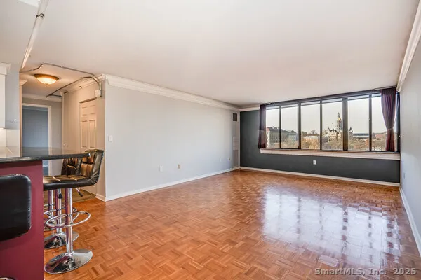 a view of an empty room and a window