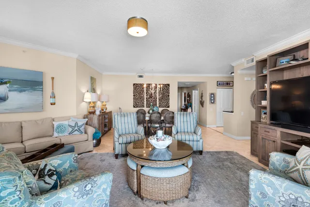 a spacious bedroom with a bed and ceiling fan