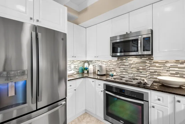 a kitchen with sink a table and chairs