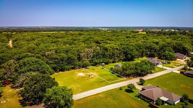 an aerial view of a residential houses with outdoor space and swimming pool