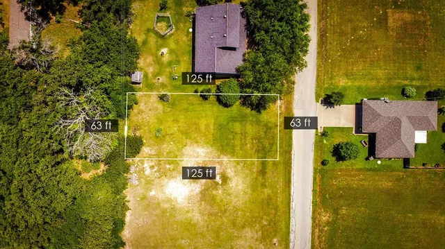 an aerial view of residential houses with swimming pool