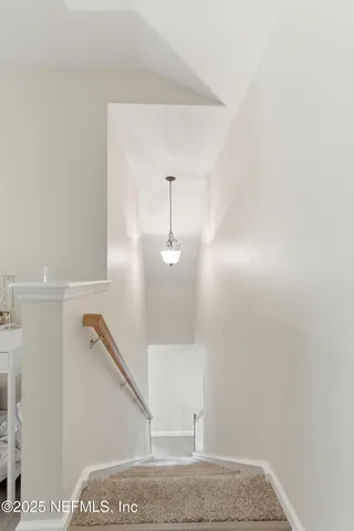 a view of a hallway with staircase