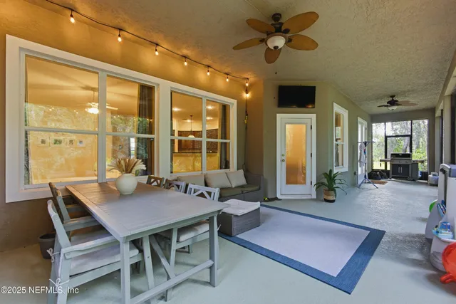 a view of a dining room with furniture window and outside view