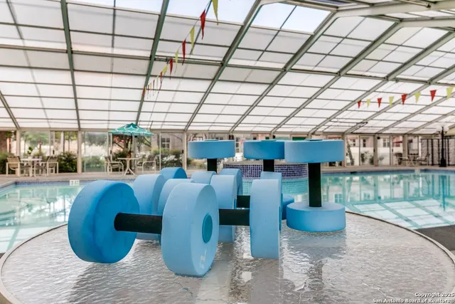 a view of a swimming pool with a patio