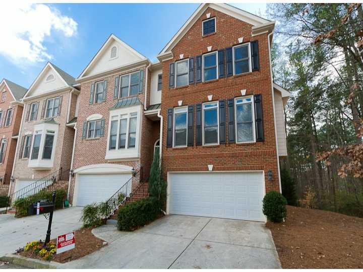 2447 Oak Grove Vista, Unit 2447 Decatur, GA 30033 - Photo 1 of 1 a front view of a house with garden