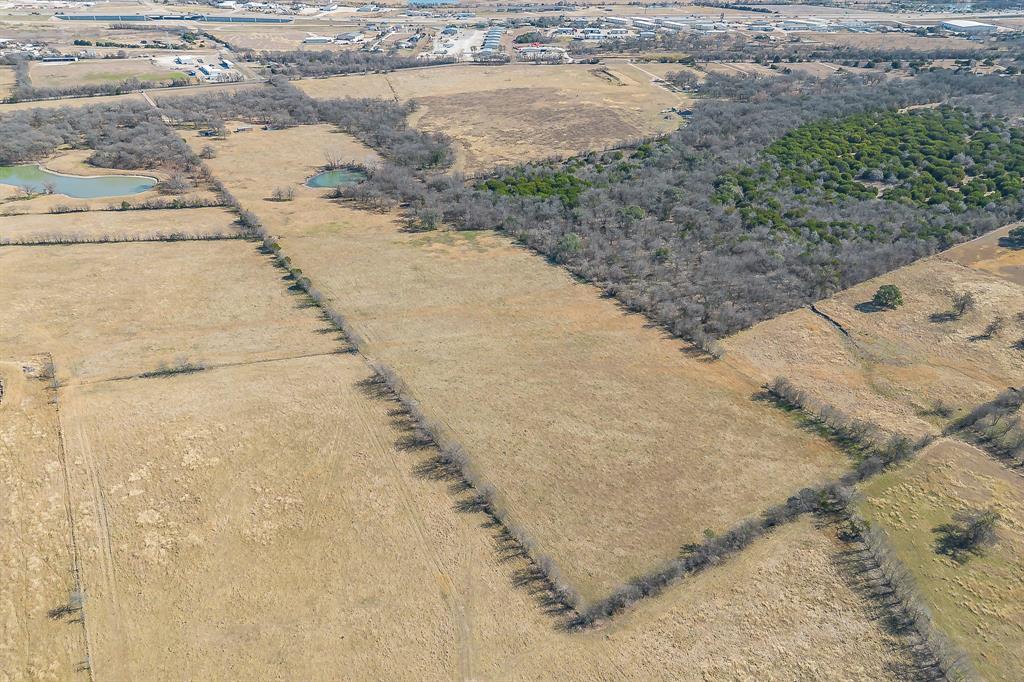 1325 North Katy Road Elm Mott, TX 76640 - Photo 26 of 29 Aerial perspective showcasing the scale of the land and the peaceful nature of the surrounding area.
