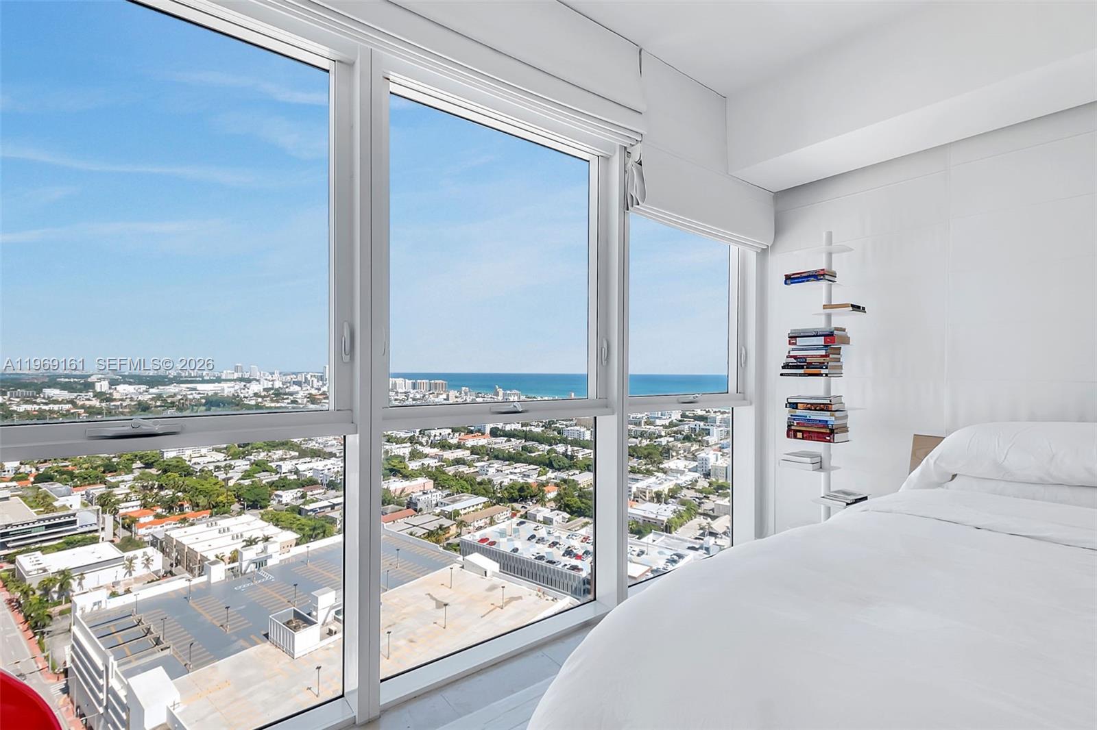 450 Alton Road, Unit 3208 Miami Beach, FL 33139 - Photo 9 of 48 a bed room with a bed and a window