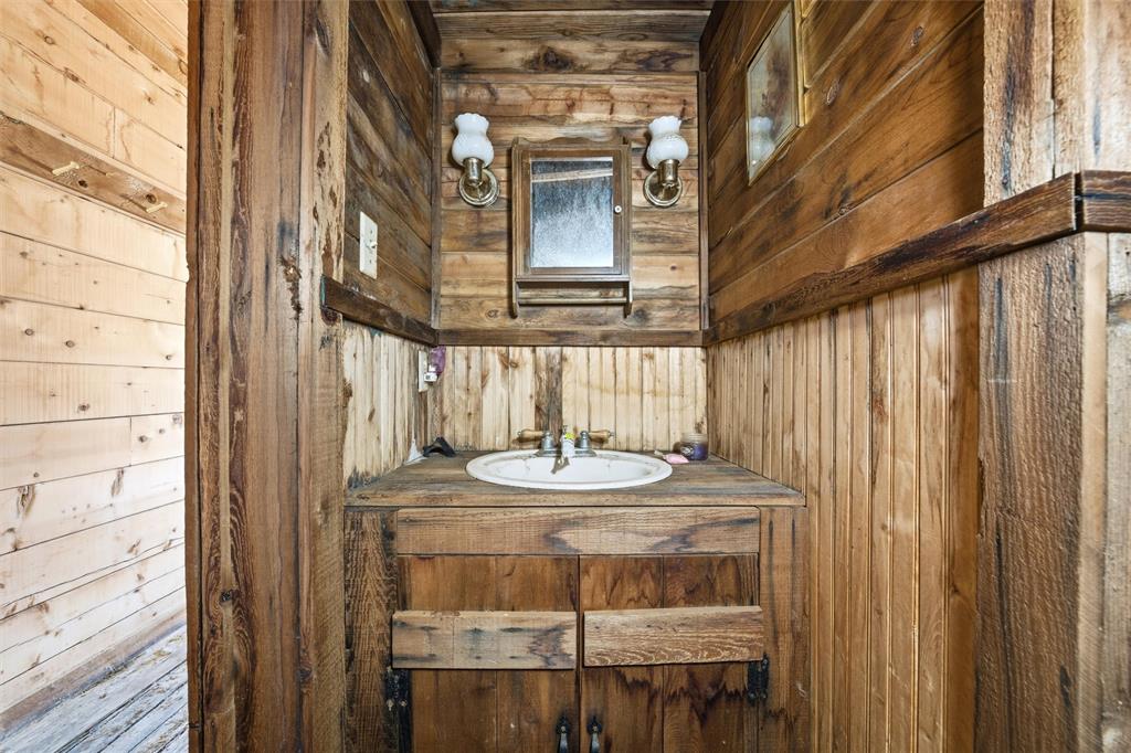 1615 Blue Cut Road South Moody, TX 76557 - Photo 16 of 21 a bathroom with a granite countertop sink and a mirror
