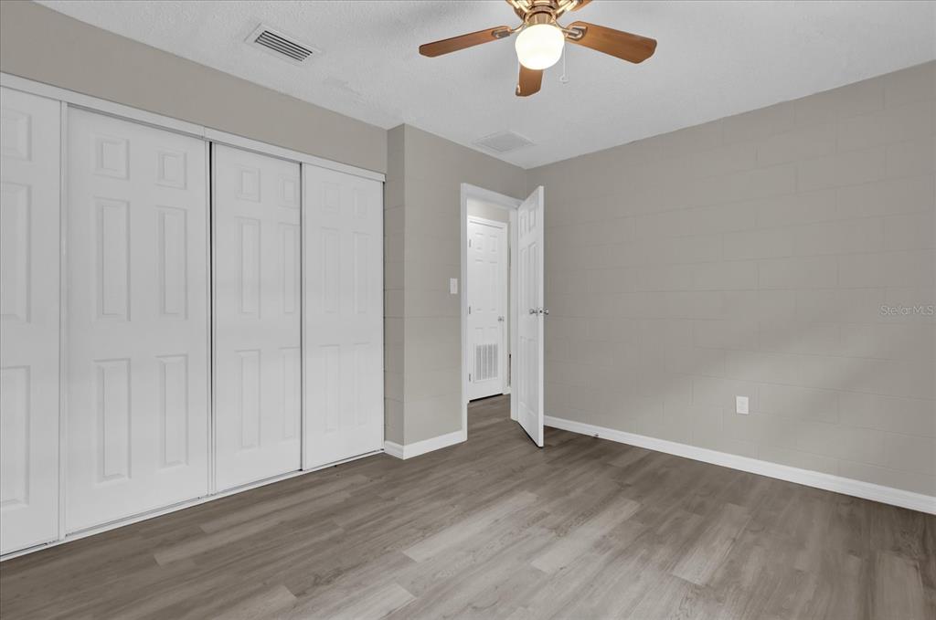 2307 Mispah Avenue, Unit A Leesburg, FL 34748 - Photo 13 of 25 a view of an empty room with wooden floor