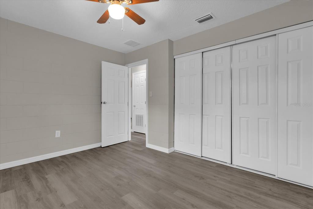 2307 Mispah Avenue, Unit A Leesburg, FL 34748 - Photo 21 of 25 a view of an empty room with wooden floor