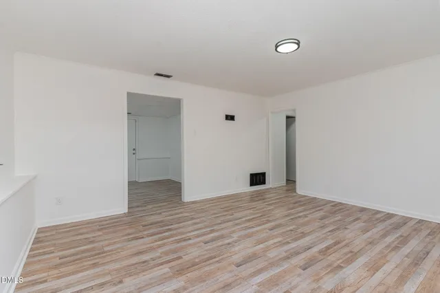 a kitchen with stainless steel appliances a sink stove and microwave