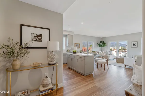 a kitchen with a sink a stove and cabinets