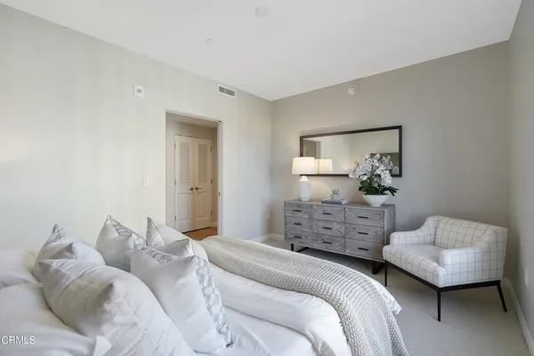 a floor view with two white comforter