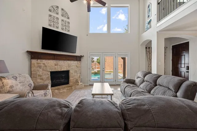 a living room with furniture fireplace and flat screen tv