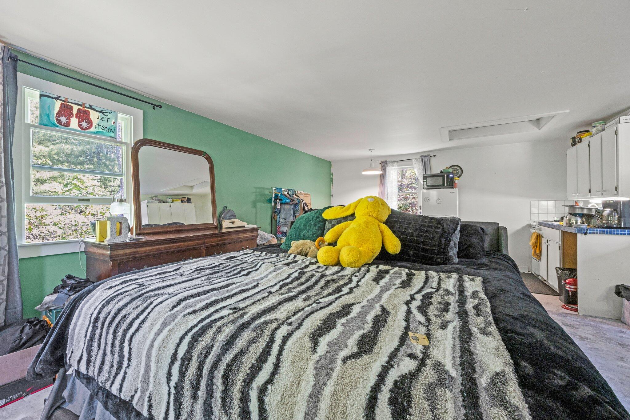 80 Old Long Pond Road Wellfleet, MA 02667 - Photo 49 of 59 a bedroom with a bed and window