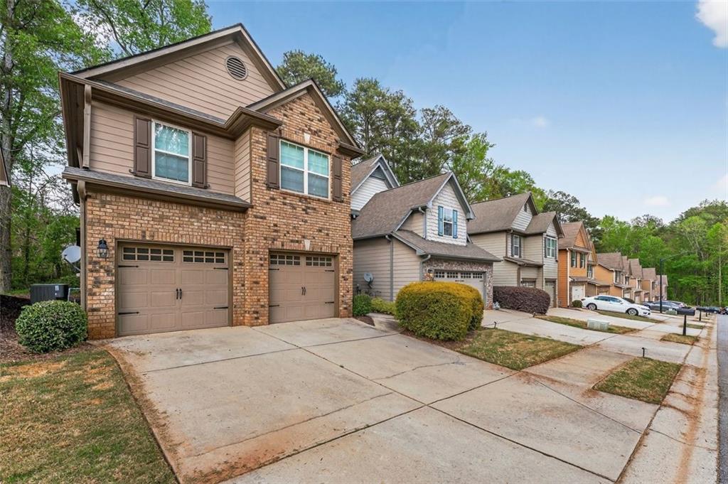 113 Tyson Woods Road Acworth, GA 30102 - Photo 2 of 37 a front view of a house with garden