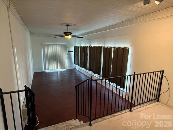 a view of balcony with wooden floor