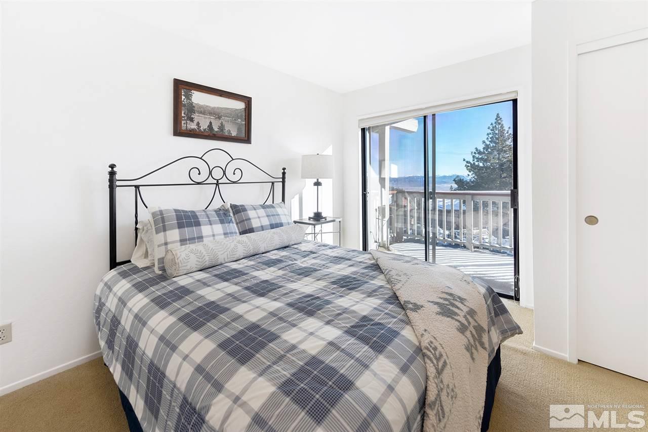 755a Bigler Circle, Unit B Stateline, NV 89449 - Photo 17 of 23 a bedroom with a bed and a painting on the wall