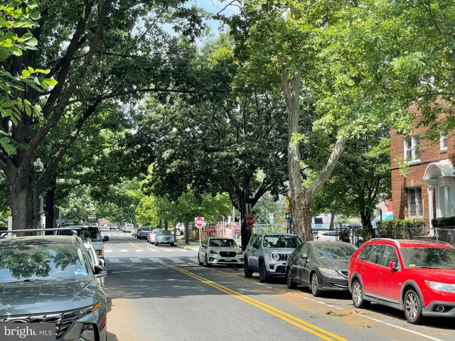 a view of street with parked cars