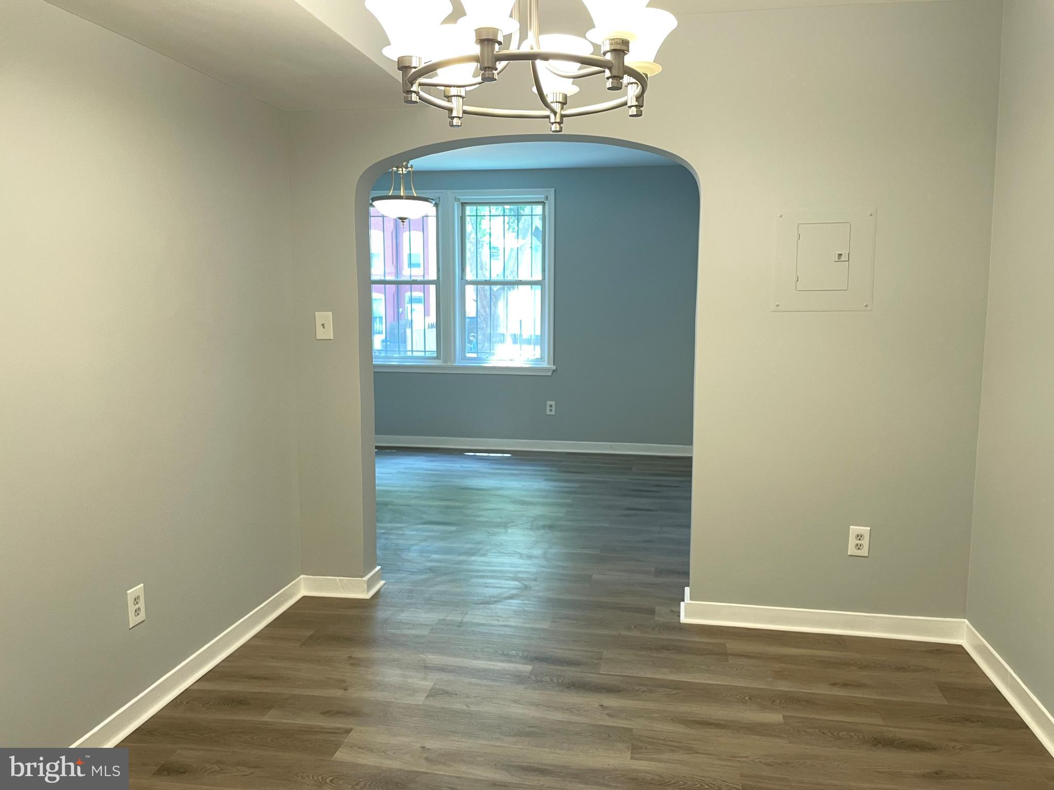 600 I Street Northeast, Unit 2 Washington, DC 20002 - Photo 4 of 19 a view of a room with wooden floors and chandelier