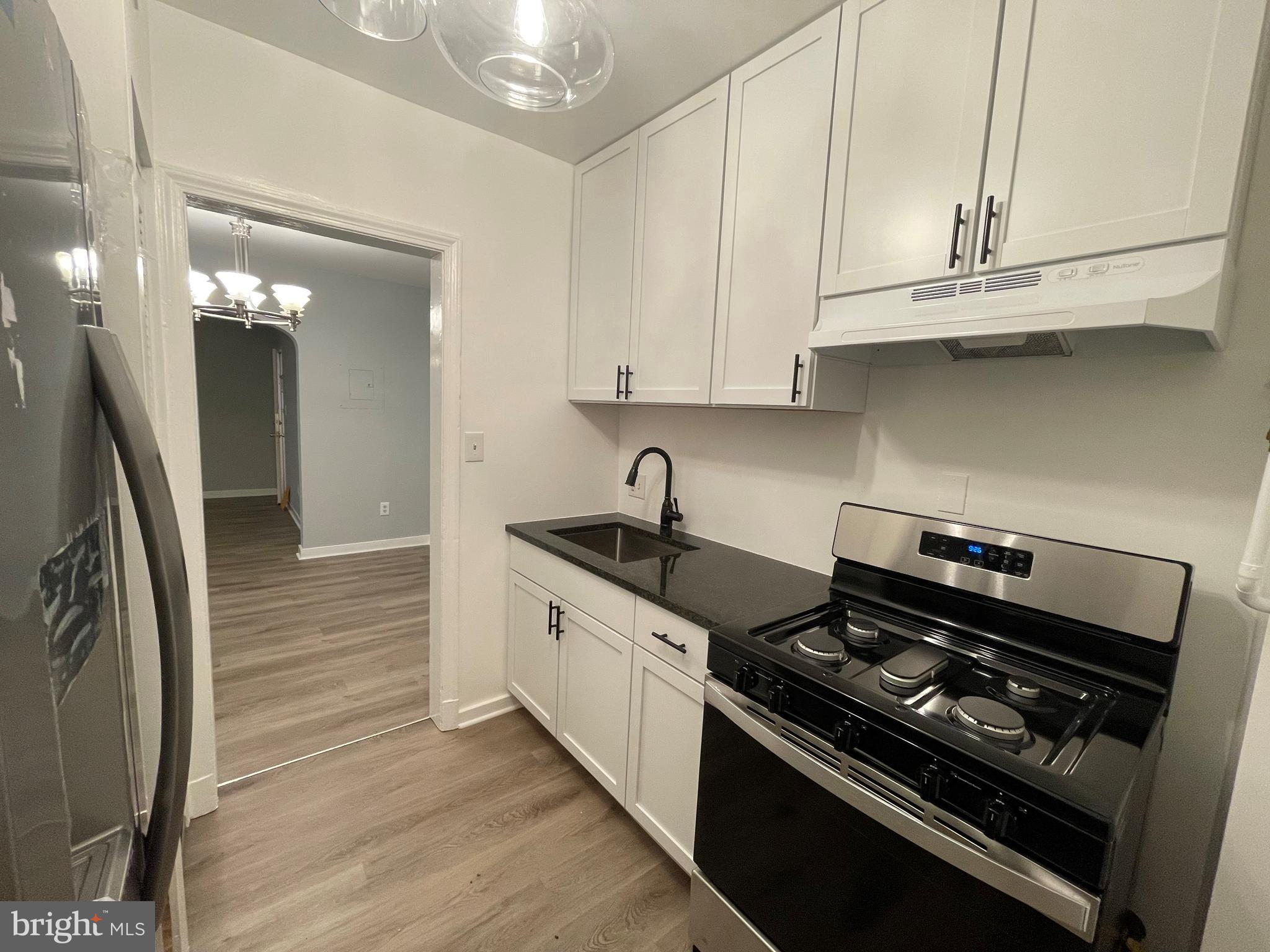 600 I Street Northeast, Unit 2 Washington, DC 20002 - Photo 6 of 19 a kitchen with stainless steel appliances granite countertop a stove and a refrigerator