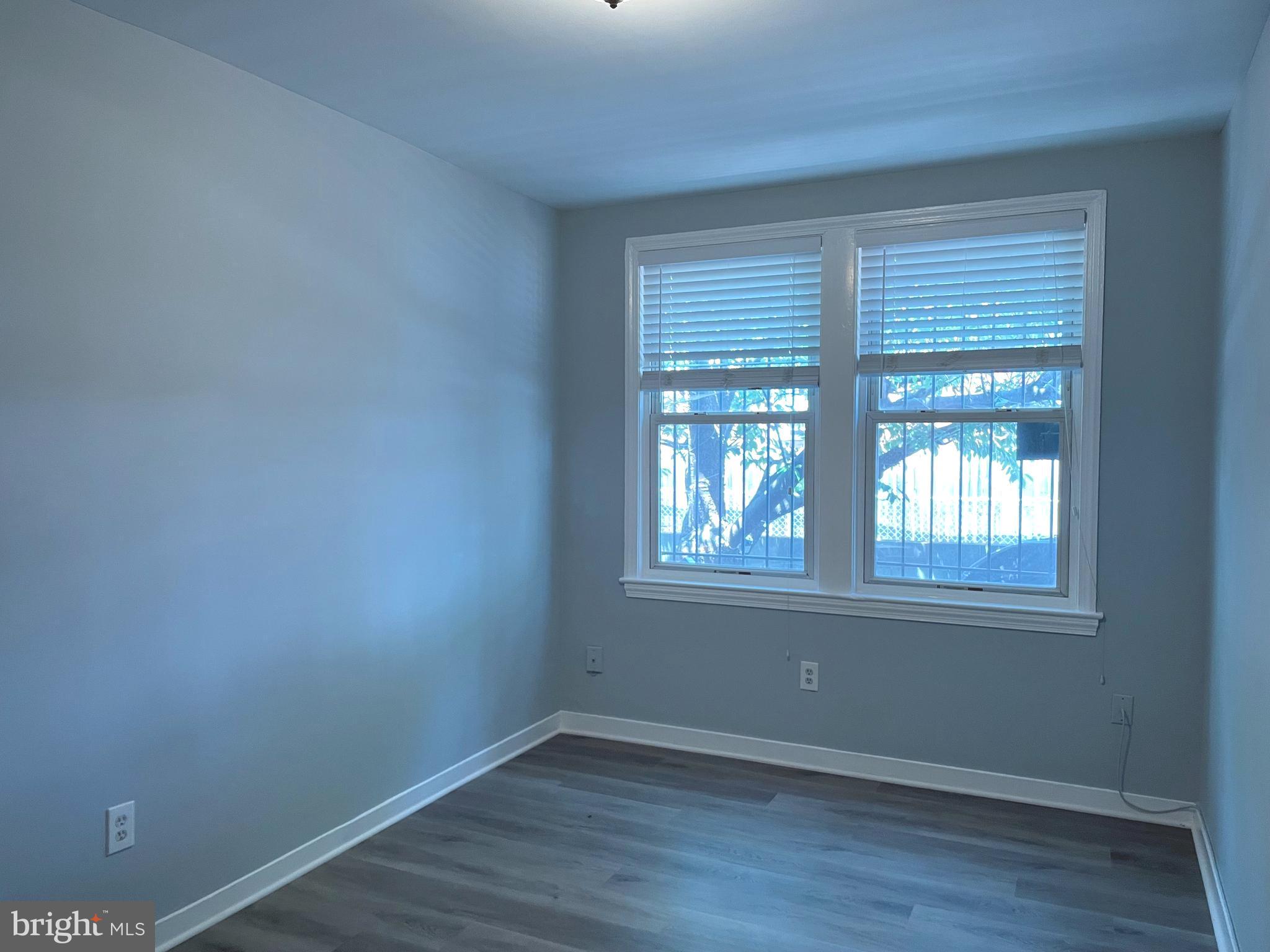 600 I Street Northeast, Unit 2 Washington, DC 20002 - Photo 8 of 19 an empty room with wooden floor and windows