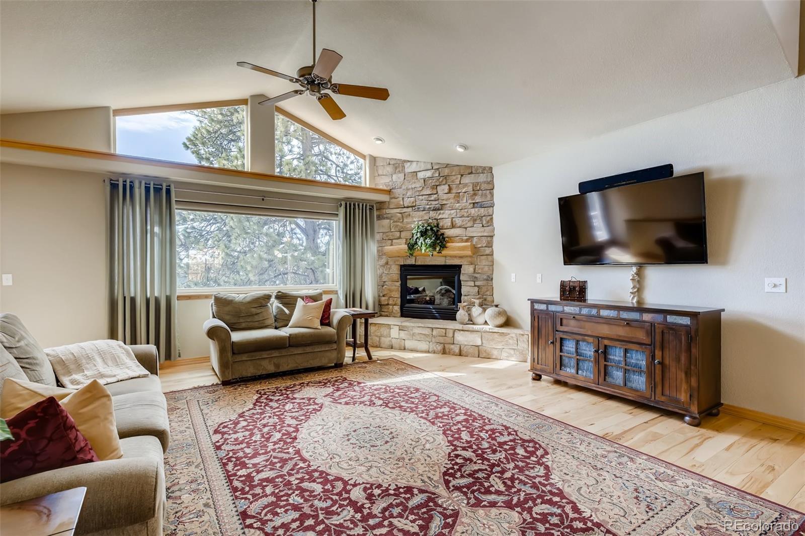 35681 Upper Aspen Lane Pine, CO 80470 - Photo 11 of 36 a living room with furniture and a flat screen tv
